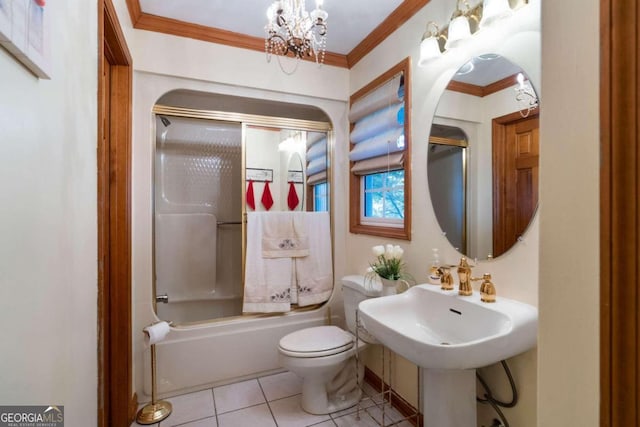 bathroom with tile patterned floors, crown molding, bath / shower combo with glass door, and toilet