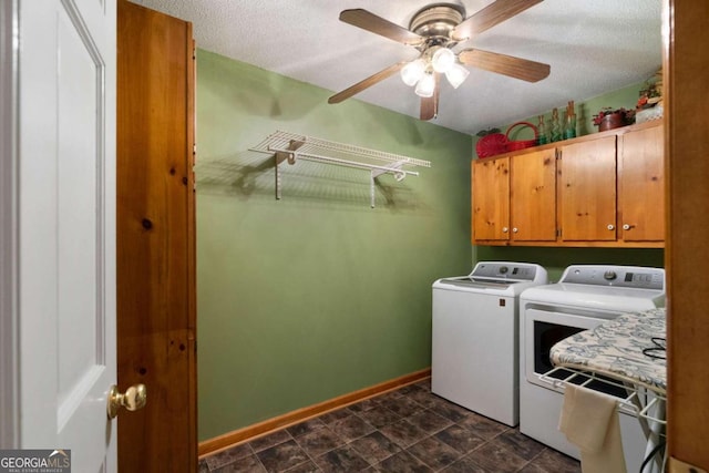 washroom with cabinets, a textured ceiling, washing machine and dryer, and ceiling fan