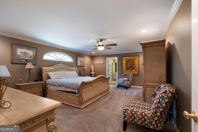 bedroom with light carpet, ornamental molding, ensuite bath, and ceiling fan