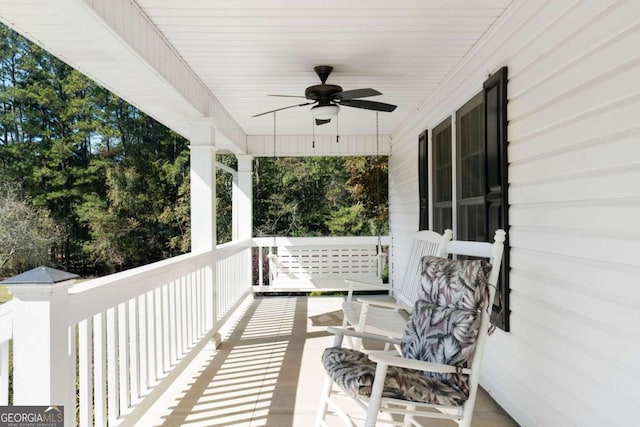 exterior space with a porch and ceiling fan