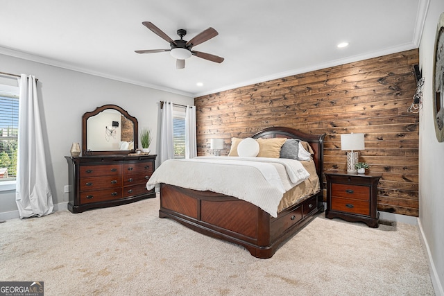 bedroom with light carpet, wood walls, ornamental molding, and ceiling fan