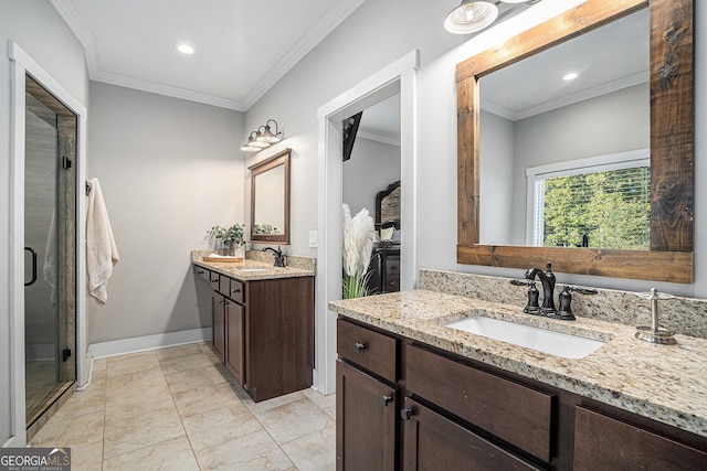 bathroom featuring vanity, crown molding, and walk in shower