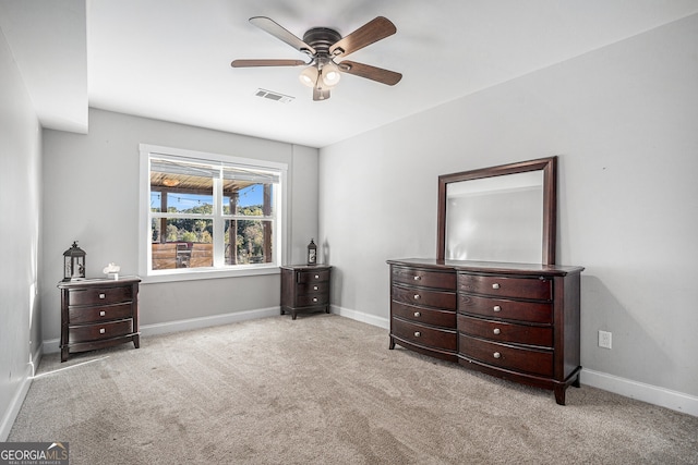 bedroom with light colored carpet and ceiling fan