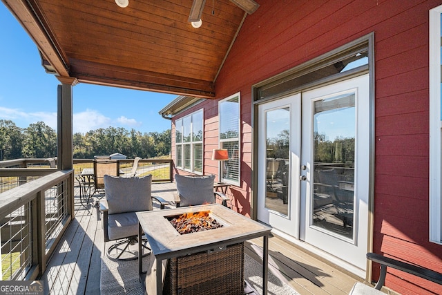 deck with an outdoor fire pit