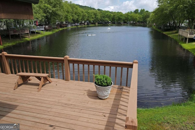 wooden deck with a water view