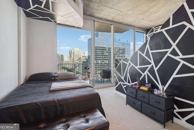 bedroom featuring floor to ceiling windows, carpet flooring, and access to exterior