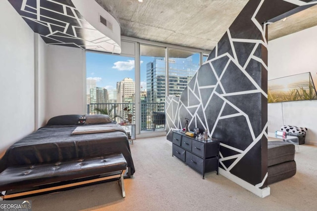 bedroom with access to outside, expansive windows, and carpet