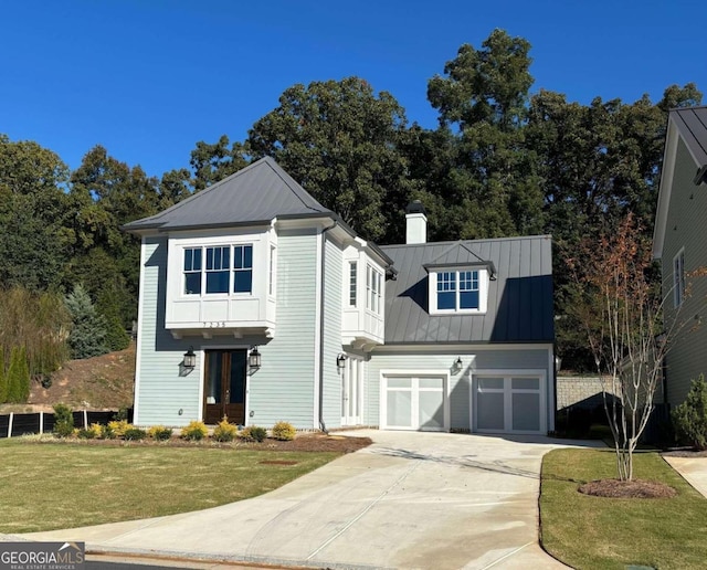 view of front property with a front yard and a garage