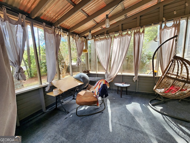 sunroom featuring lofted ceiling