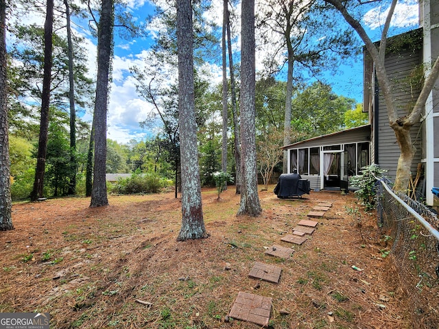 view of yard featuring a sunroom