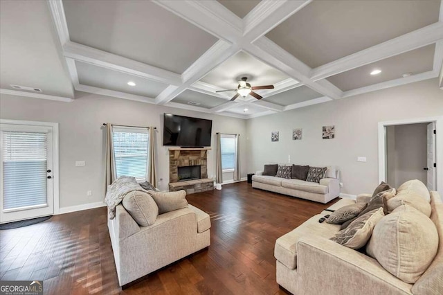 living room with beam ceiling, coffered ceiling, dark hardwood / wood-style floors, and ceiling fan