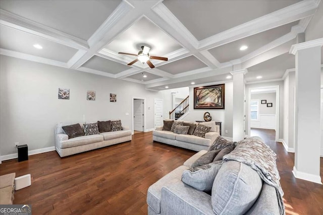 living room with coffered ceiling, beam ceiling, ornamental molding, dark hardwood / wood-style flooring, and ceiling fan