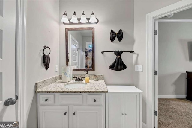 bathroom with vanity and ornamental molding