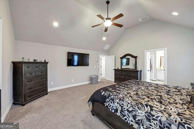 carpeted bedroom with ceiling fan, ensuite bath, and vaulted ceiling