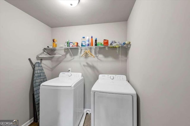 clothes washing area featuring washer and dryer