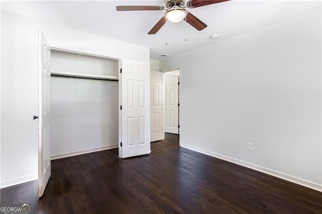 504 Milligan Dr, Stone Mountain, GA 30083 - unfurnished bedroom featuring wood finished floors, baseboards, a closet, and a ceiling fan