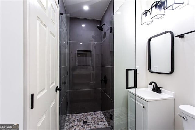 504 Milligan Dr, Stone Mountain, GA 30083 - bathroom featuring a shower stall, toilet, vanity, and recessed lighting