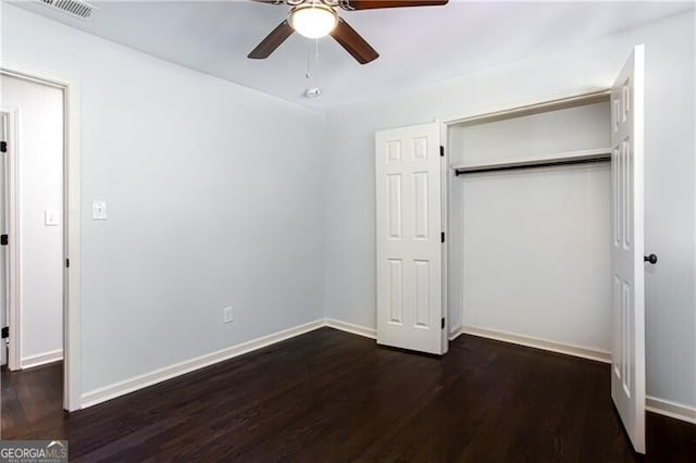 504 Milligan Dr, Stone Mountain, GA 30083 - unfurnished bedroom with wood finished floors, a closet, baseboards, and a ceiling fan