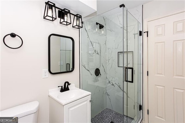 504 Milligan Dr, Stone Mountain, GA 30083 - bathroom featuring a marble finish shower, toilet, and vanity