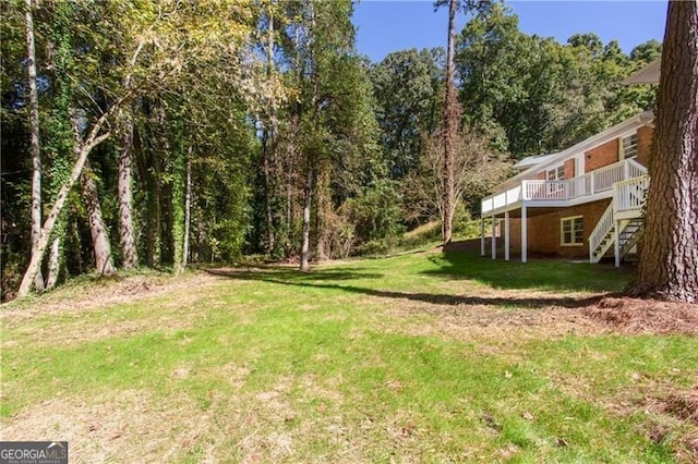 504 Milligan Dr, Stone Mountain, GA 30083 - view of green lawn featuring a wooden deck and stairway