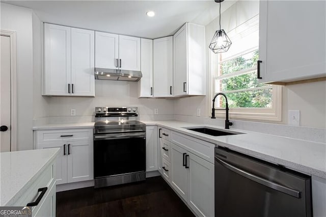 504 Milligan Dr, Stone Mountain, GA 30083 - kitchen with appliances with stainless steel finishes, a sink, under cabinet range hood, white cabinets, and recessed lighting