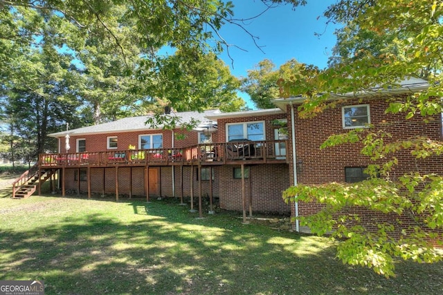 back of property with a deck and a lawn