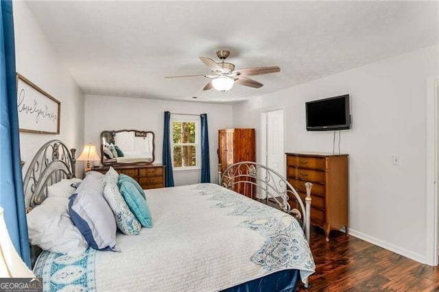 bedroom featuring dark hardwood / wood-style flooring and ceiling fan