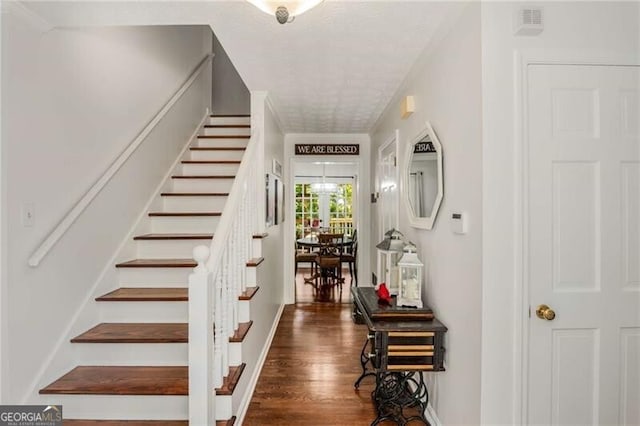 stairway featuring wood-type flooring