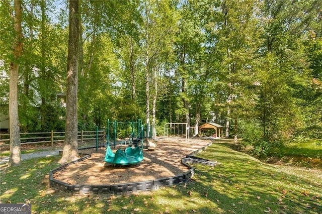 view of playground with a lawn