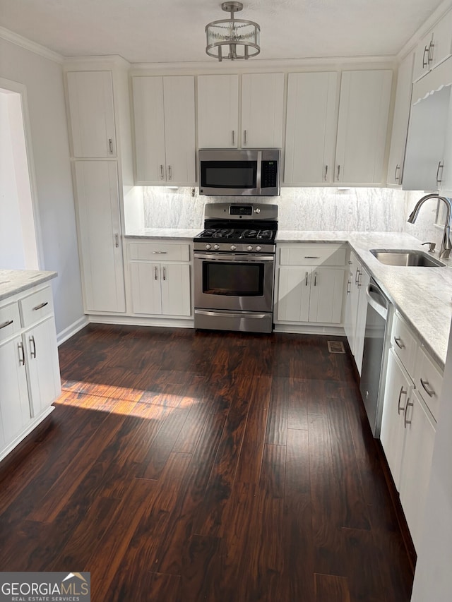 kitchen with sink, white cabinets, and stainless steel appliances