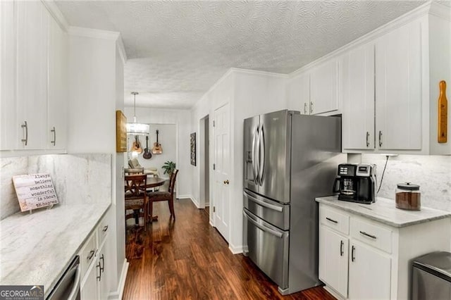 kitchen with white cabinets, dark hardwood / wood-style floors, a textured ceiling, decorative light fixtures, and stainless steel appliances