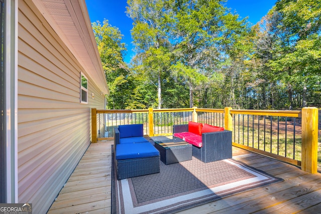 wooden terrace featuring outdoor lounge area