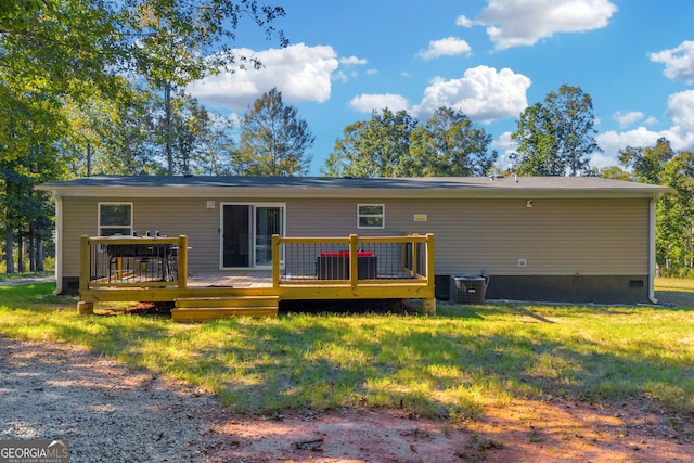 rear view of property featuring cooling unit and a deck