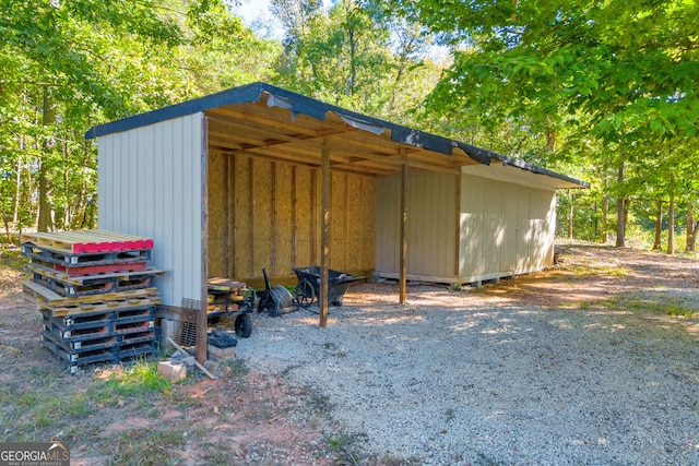 view of outbuilding with a carport