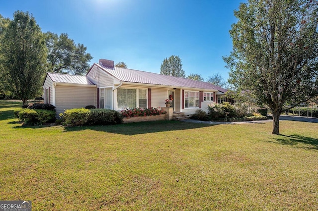 single story home featuring a front yard