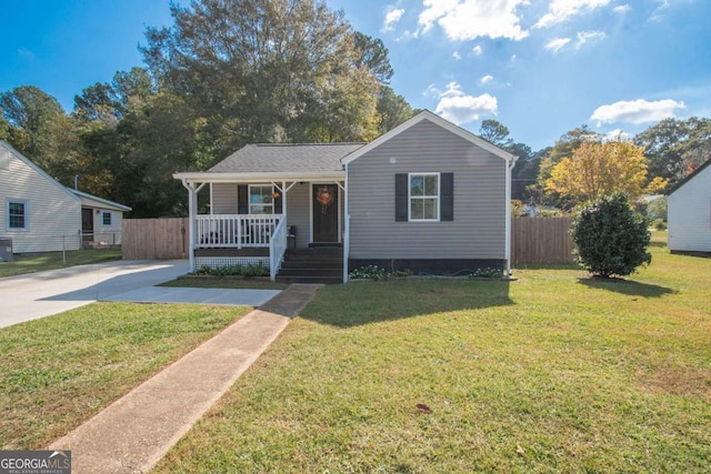 bungalow-style house with a front yard and a porch