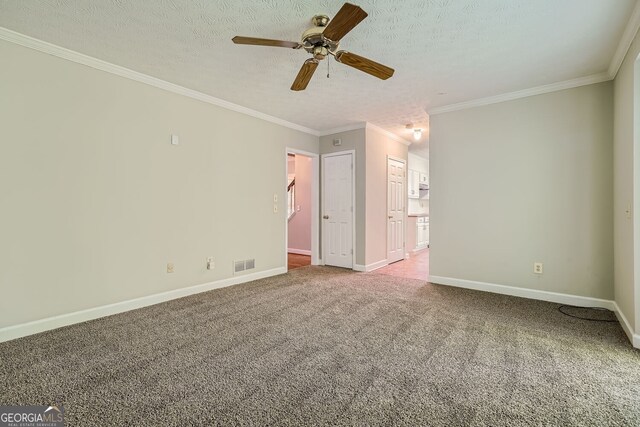 2459 Jacks View Ct, Snellville, GA 30078 - empty room featuring a ceiling fan, carpet, ornamental molding, baseboards, and a textured ceiling