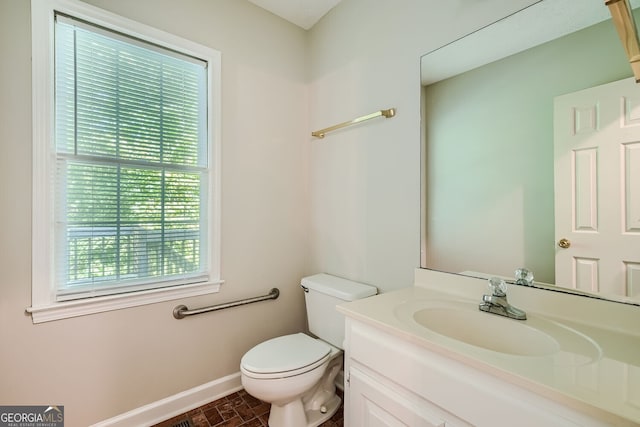 bathroom with toilet and vanity