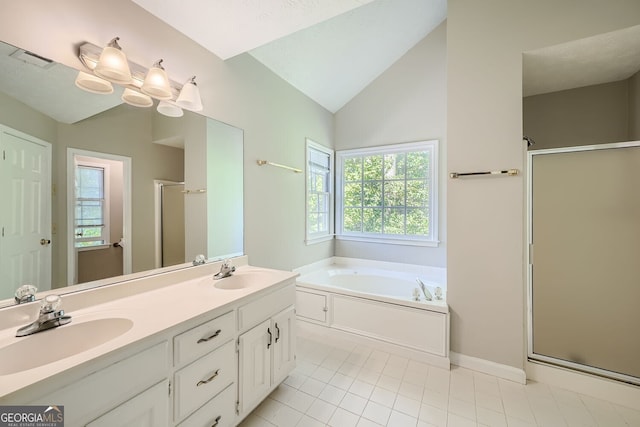 bathroom with vanity, lofted ceiling, a healthy amount of sunlight, and independent shower and bath