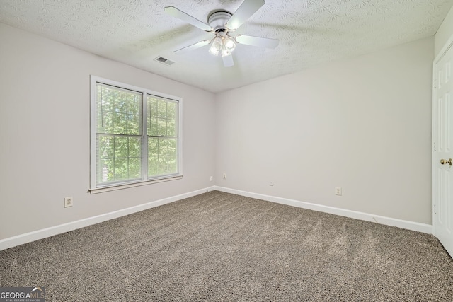 unfurnished room featuring a textured ceiling, carpet floors, and ceiling fan