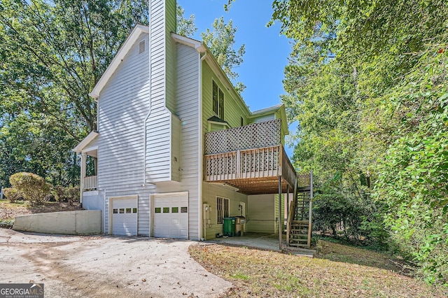 view of property exterior with a garage