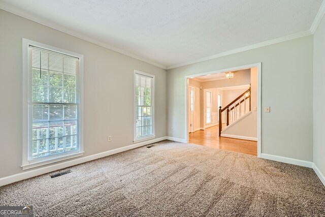 2459 Jacks View Ct, Snellville, GA 30078 - carpeted empty room with ornamental molding, baseboards, and stairs