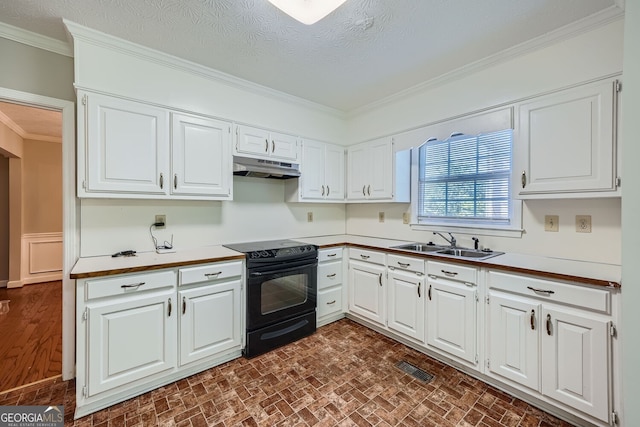 kitchen with sink, black electric range, white cabinets, and crown molding