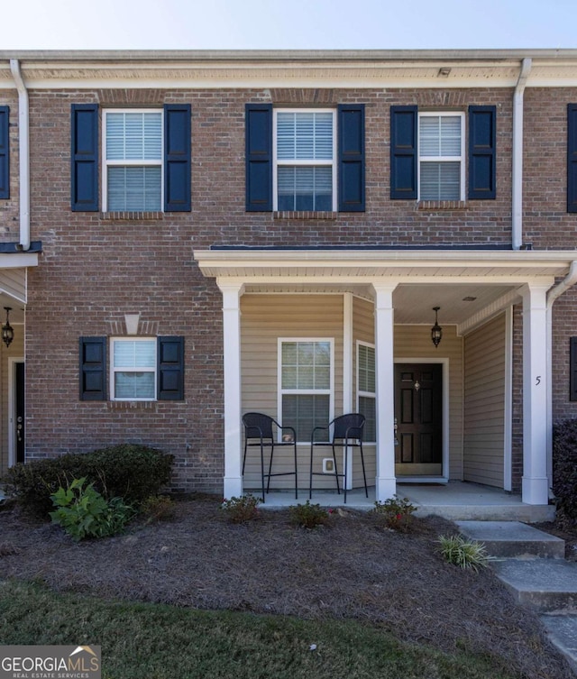 townhome / multi-family property with covered porch