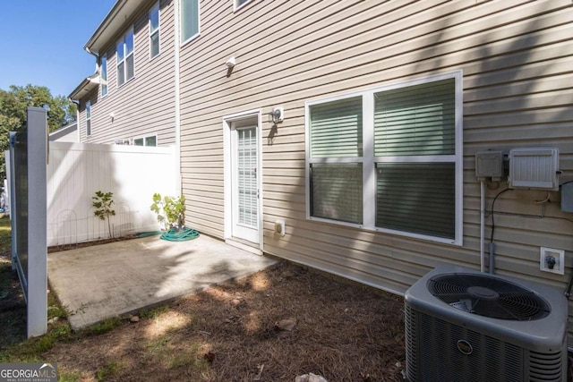 view of home's exterior featuring a patio and central AC unit