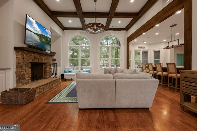 living room featuring hardwood / wood-style floors, a healthy amount of sunlight, and a fireplace