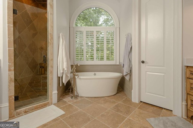 bathroom with vanity, plus walk in shower, and tile patterned floors