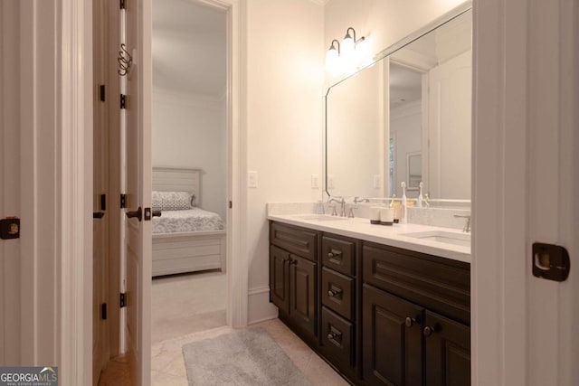 bathroom featuring vanity, ornamental molding, and tile patterned flooring