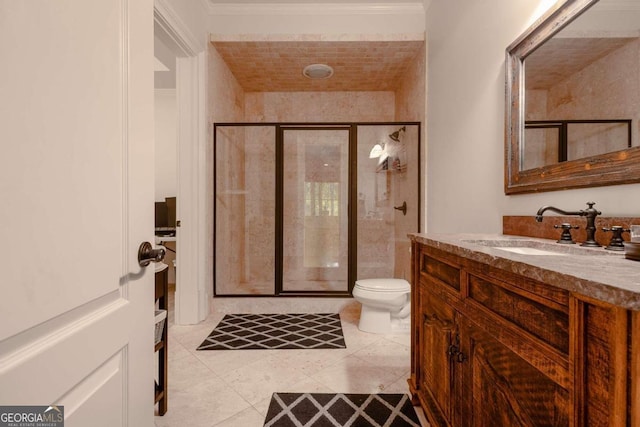 bathroom with toilet, crown molding, vanity, an enclosed shower, and tile patterned flooring