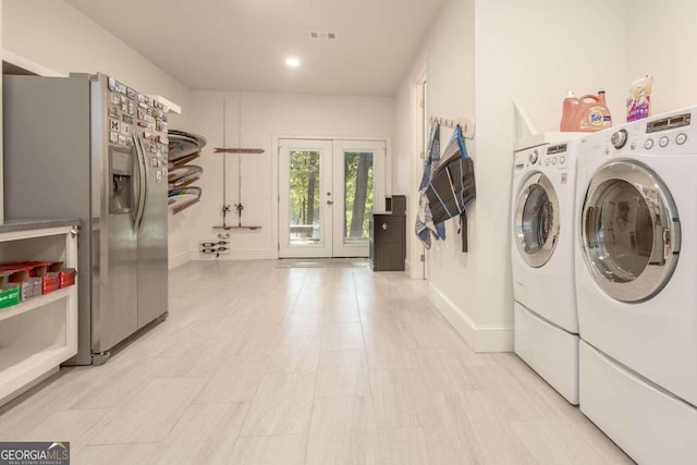 washroom with french doors and washer and dryer